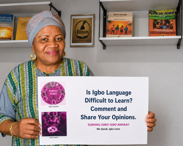 Benedette Okorie (Onyenkuzi Igbo) holding a sign about learning Igbo